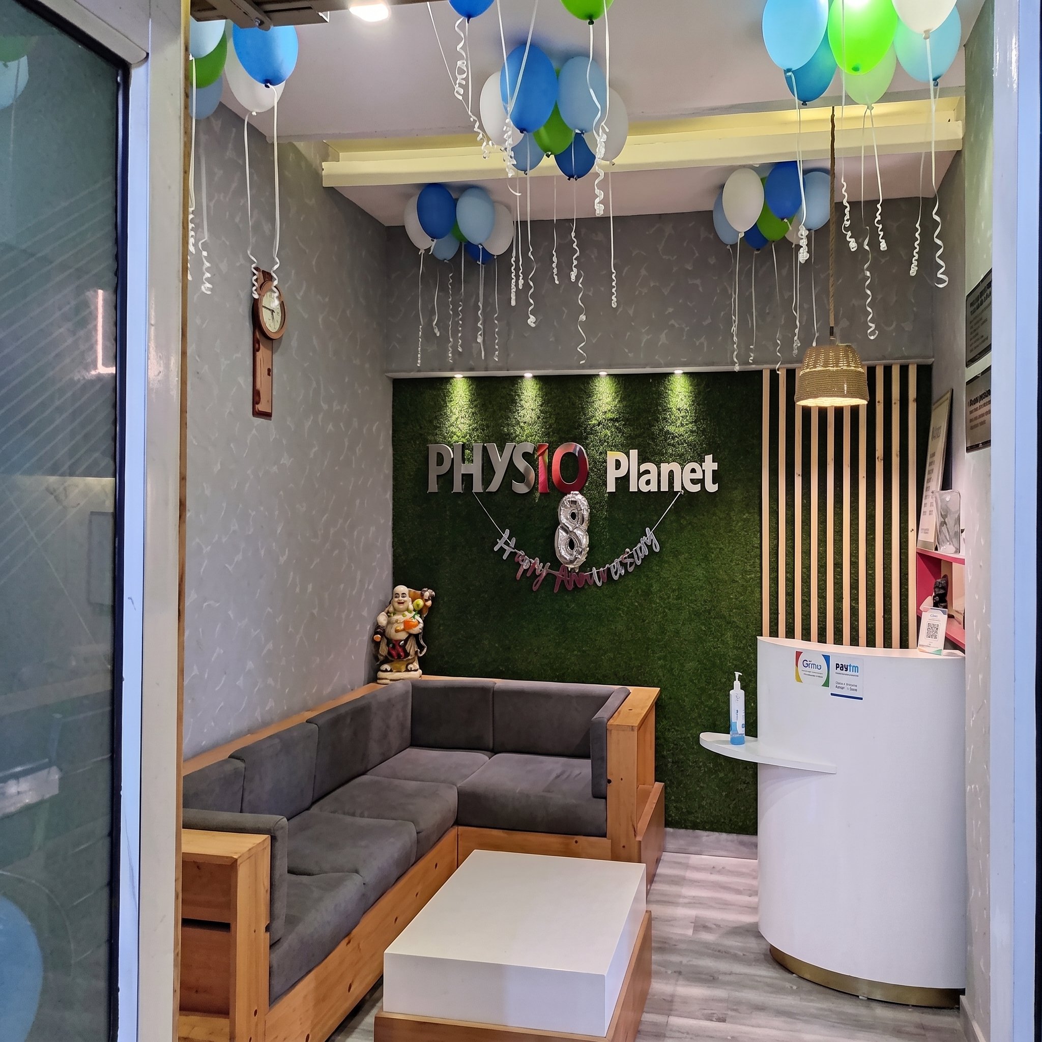 The Physio Planet clinic reception in Sector 6, Panchkula, with the clinic's green branded wall