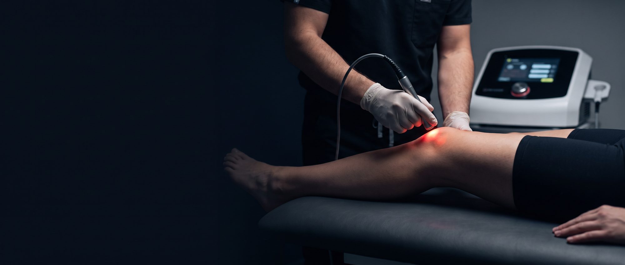 High-power laser therapy being applied to a patient's knee
